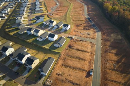 Ground prepared for building of new residential houses in South Carolina suburban development area. Concept of growing american suburbs
