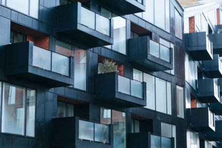 contemporary black building exterior with balconies