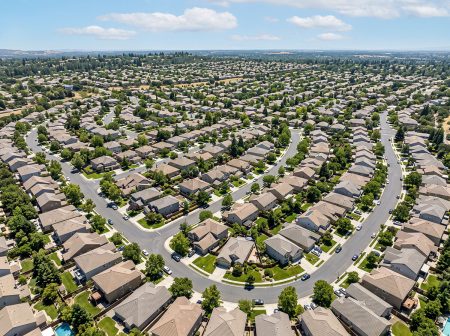 magnific aerial view of densely populated new housing development